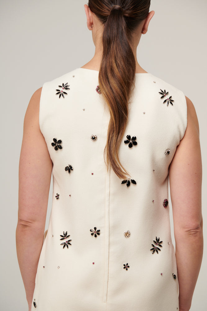 Sleeveless shift dress with clusters of sparkling crystal beads